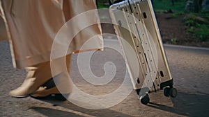 Closeup tourist feet stepping on tarmac road. Woman walking sunny pathway