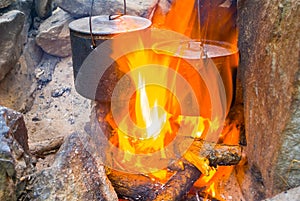 closeup touristic cauldron in a fire