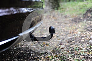 Closeup of tow bar of a car parked n the woods