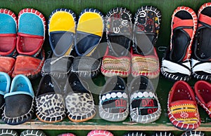 Closeup of traditional colorful Yemeni leather shoes displayed at  a market