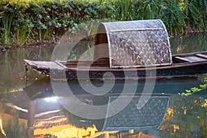 Closeup of a traditional fishing boat in the river. Meishan, Sichuan, China.