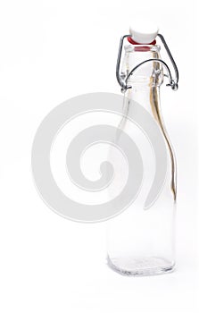 Closeup traditional glass top bottle white background
