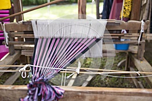 Closeup traditional Thai style wooden weaving loom, selective focus