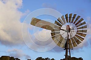 Closeup of a traditional windmill  in a picturesque landscape on a sunny hillside