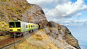 Closeup of train exiting a tunnel. View from Cliff Walk Bray to Greystones, Ireland