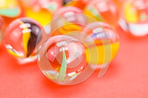 Closeup of transparent glass balls on a pink background