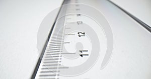 Closeup of a transparent plastic ruler on a white background