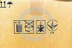 Closeup of transportation symbols on cardboard box