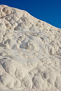 Closeup of travertine pools and terrace rock in Pamukkale, Turkey in famous tourism holiday or vacation destination