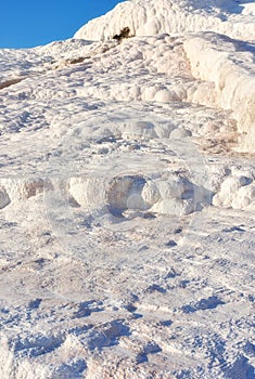 Closeup of travertine pools and terraces in Pamukkale, Turkey. Travelling abroad for holiday and tourism. Cotton castle