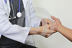 Closeup Treatment of lock finger symptoms or parkinson`s disease on white background,Healthy concept