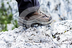 Closeup of trekking boot in the mountain