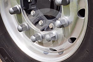 Closeup of a truck wheel. Tire, rim, bolts