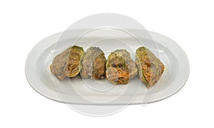 Closeup of a Turkish and Arabic Traditional Kabak Cicegi Dolmasi isolated on a white background photo