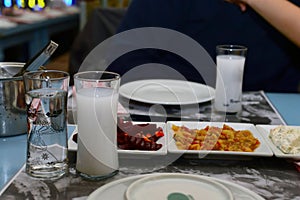Closeup of Turkish raki and appetizers on table