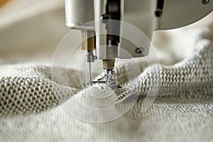 closeup of a twin needle sewing a doublestitched seam on jersey