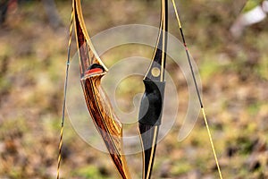 Closeup of two Archery Bows made of wood called Longbow