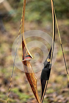 Closeup of two Archery Bows made of wood called Longbow