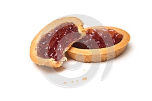 two crunched mini tartlets with strawberry jam on white background photo