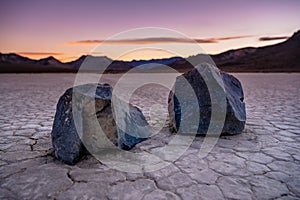 Closeup of Two Dark Sailing Stones At Sunset