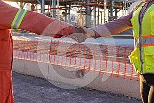 Closeup of two engineers shaking hands