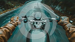 Closeup of two hands on motorcycle handlebars, motorcyclist on paved road