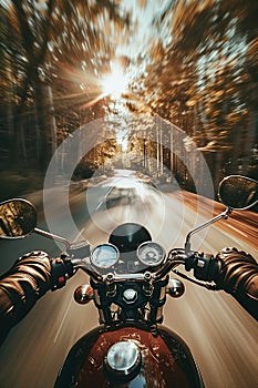 Closeup of two hands on motorcycle handlebars, motorcyclist on paved road