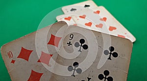Closeup of two playing cards nine of clubs and ten of diamonds