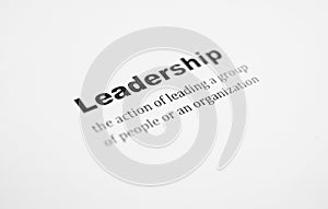 Closeup of a typed definition of the word leadership. Paper sheet