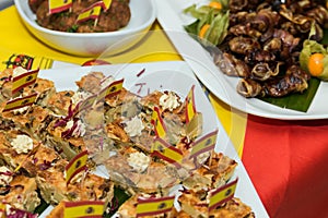 Closeup of a typical spanish pincho de tortilla, spanish omelete served on bread. Spanish tapas called pintxos of the Basque