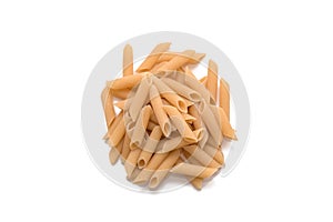 Closeup of uncooked organic penne rigate pasta on white background. Slow carbs concept. Top view
