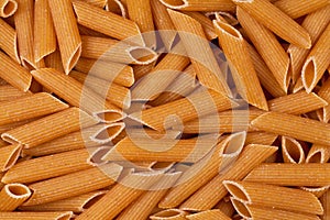 Closeup of uncooked wholewheat pasta