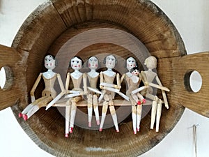 Closeup of undressed peg wooden dolls, female figurines