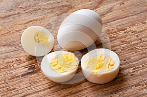 Closeup unpeeled boiled egg and half eggs on white background ,