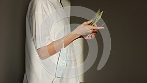 Closeup unrecognizable business woman counting american cash money. Woman hands holding one hundred dollar bills. Female