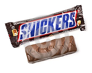 Closeup of unwrapped Snickers candy chocolate ba