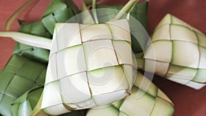 Closeup up white and green ketupat ramadan background. Ketupat frame of Idul Fitri traditional. Eid mubarak theme.