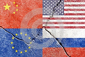 Closeup of USA, China, EU, and Russia flags on weathered and cracked wall background