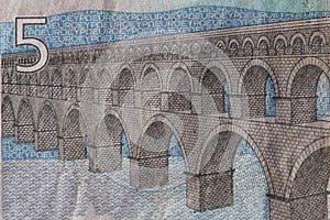 Closeup of a used 5 Euro paper money bill.