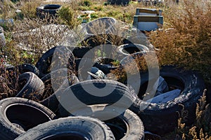 Closeup used truck tires. Old tyres waste for recycle or for landfill. Black rubber tire of truck.