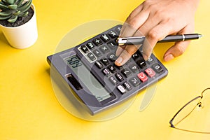 Closeup of using calculator on background stock image.