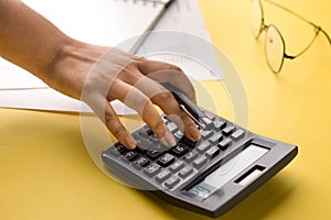 Closeup of using calculator on background stock image.