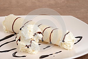 Closeup vanilla ice cream crepe with chocolate sauce