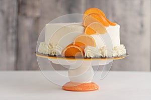 Closeup of vanilla orange cake with white frosting