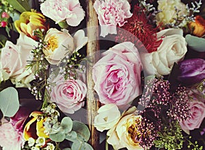 Closeup of Variety Beautiful Flowers in Wooden Basket