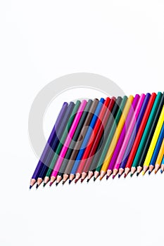 Closeup of  Various Colorful Pencils Placed Together in Row. Isolated Against White.Picture made from Upper View