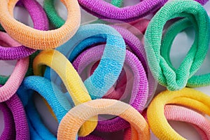 Closeup of various hair ties. Macro of multicolored elastics photo