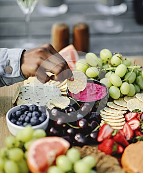 Closeup of a vegan cheese and fruit platter
