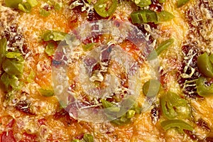 Closeup of vegan pizza with soy sausage, melted vegetarian mozzarella and jalapeno
