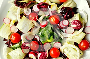 Raw ,vegan salad on a white background photo